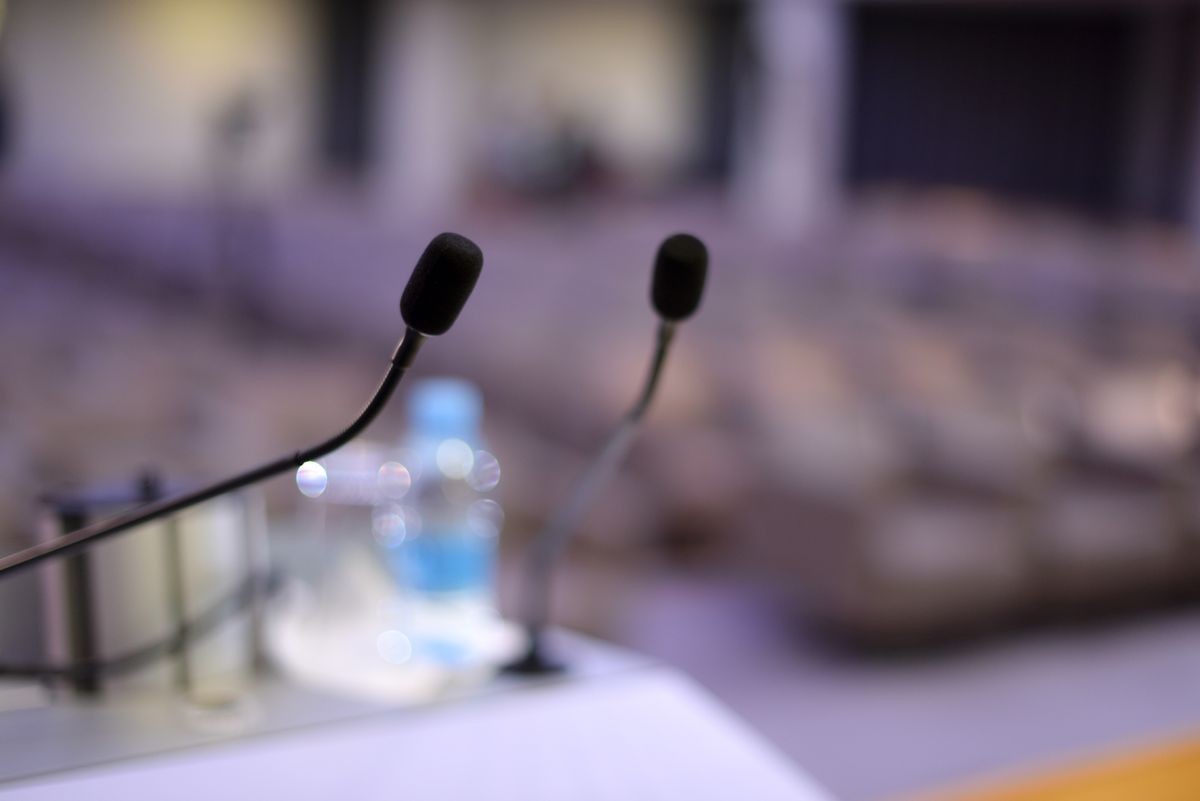 Microphones during business conference in conference room or hall, panel duscusion of economic development